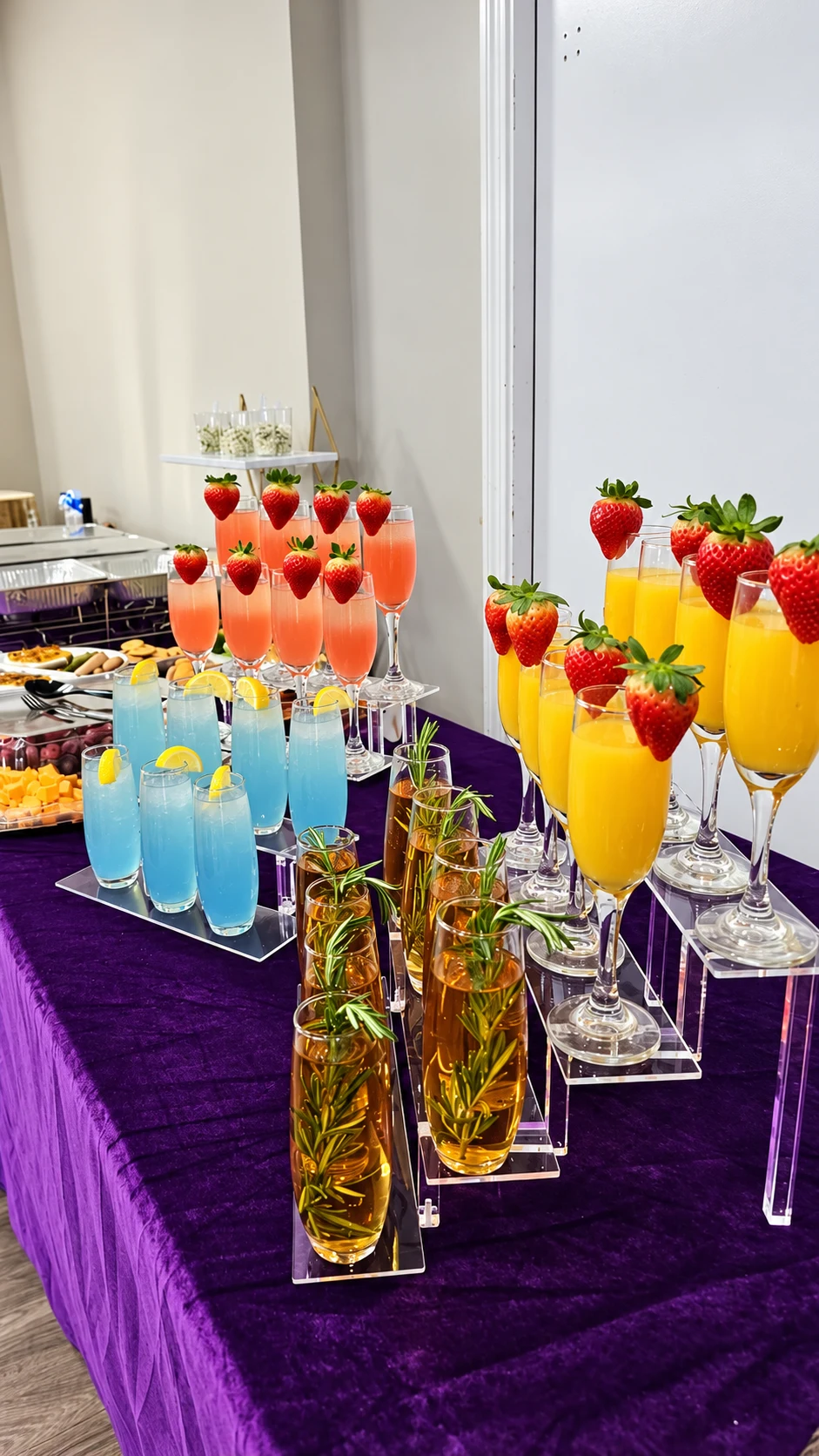 Rows of colourful mocktails with strawberry, lemon and herb garnishes