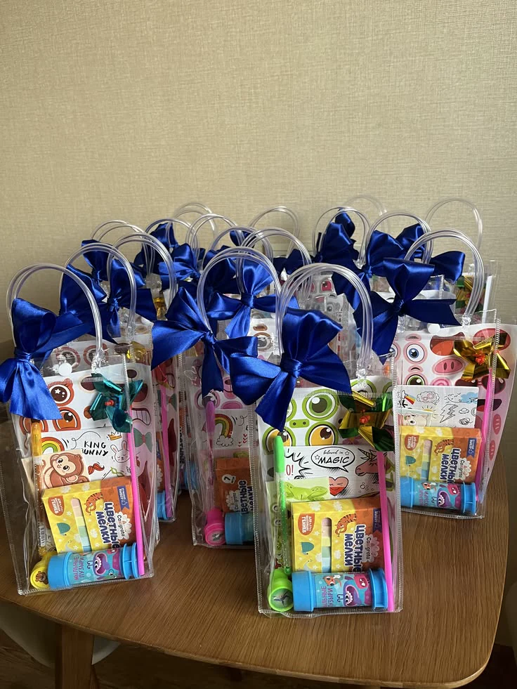 Children's activity gift bags finished with royal-blue bows