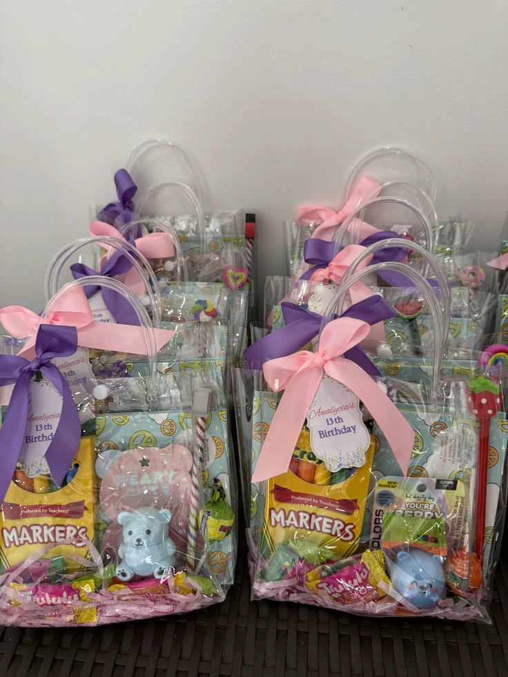 Pastel ribbon party favours filled with treats and small gifts