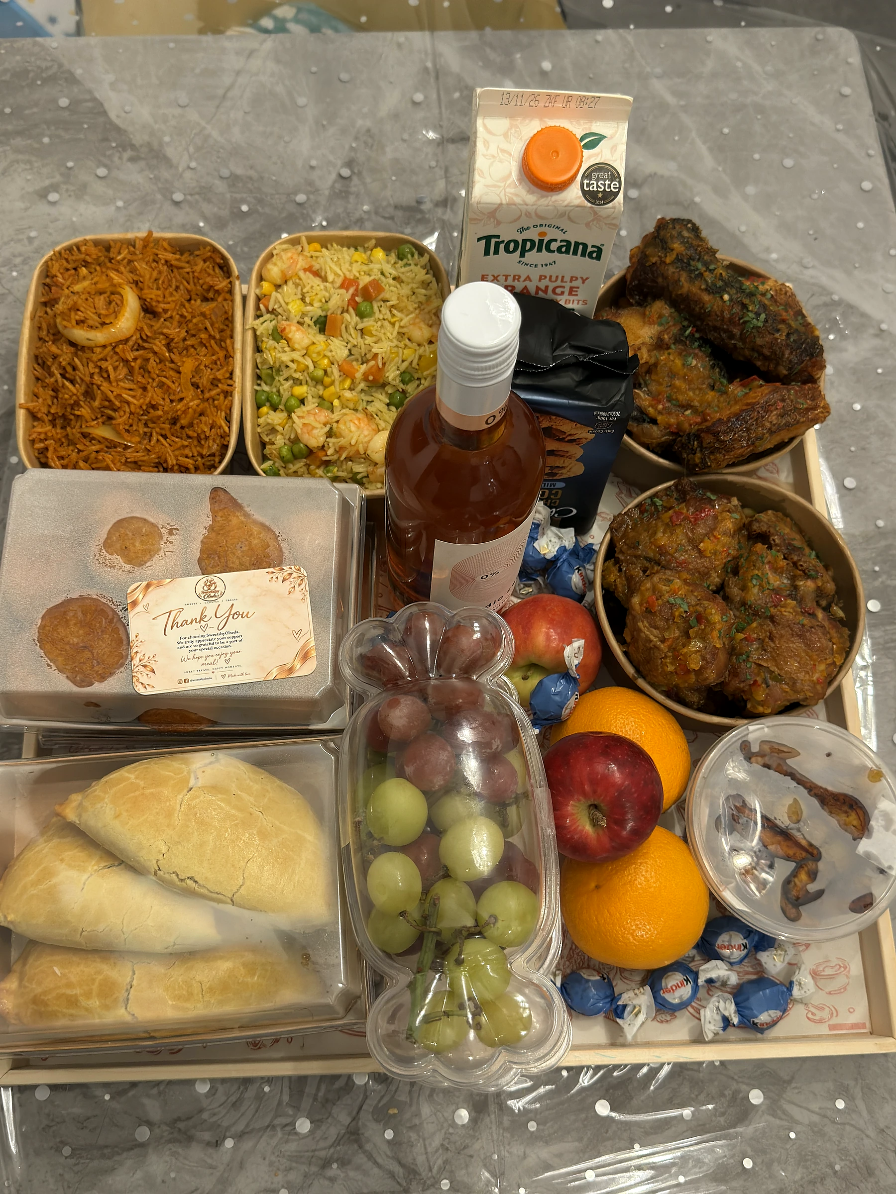 A complete catered celebration hamper with hot food, fruit, pastries and drinks