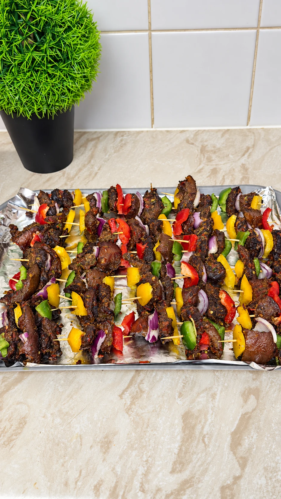 Grilled meat and pepper skewers prepared for an event