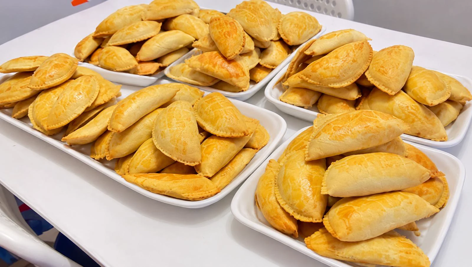 Freshly baked golden savoury pastries arranged on serving platters